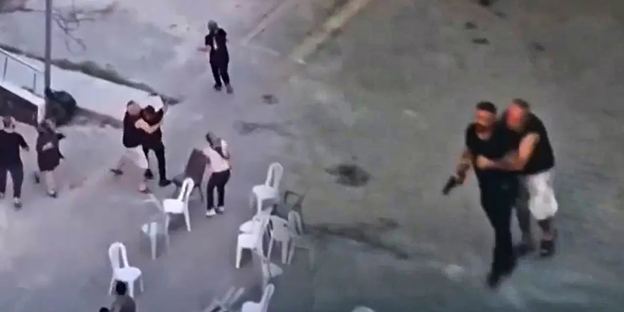 Taziye evindeki kavgada silah çekip husumetlilerini kovaladı