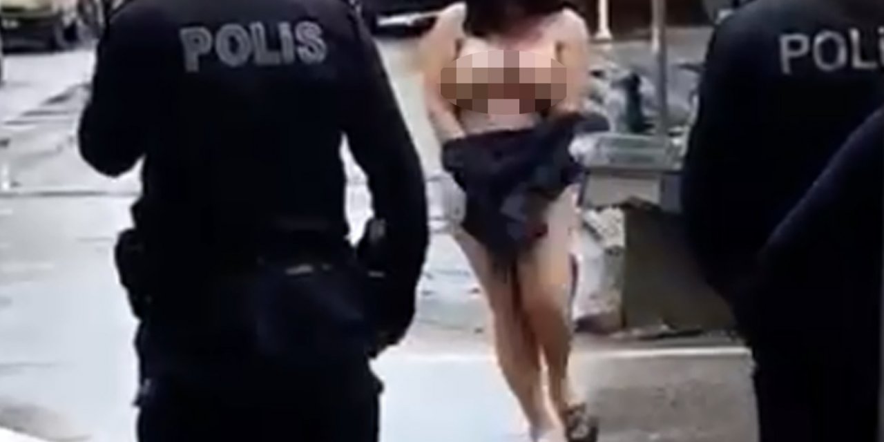 Otomobil camlarını kıran kadın, sokakta yarı çıplak oturdu