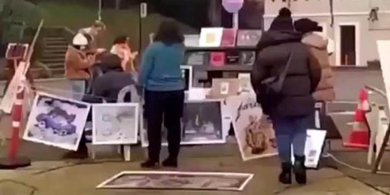 Kabe fotoğrafının yere serilmesi nedeniyle 2 kişi tutuklandı