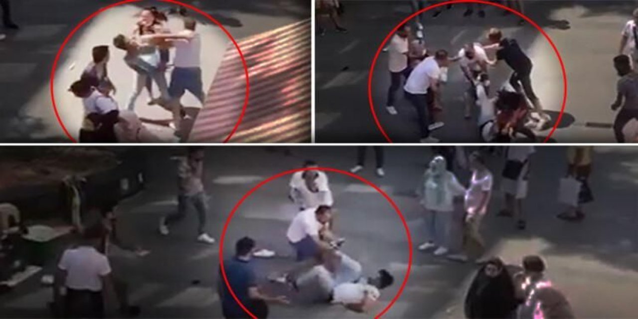 Şehrin göbeğinde tekme tokat kavga! Yere düşürüp üstüne çullandılar... Dehşete düşüren anlar kamerada...