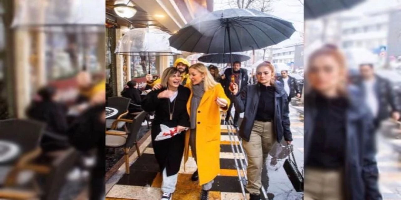 Tepkilere neden oldu: Bakanın eşi polise şemsiye tutturup çantasını taşıttı